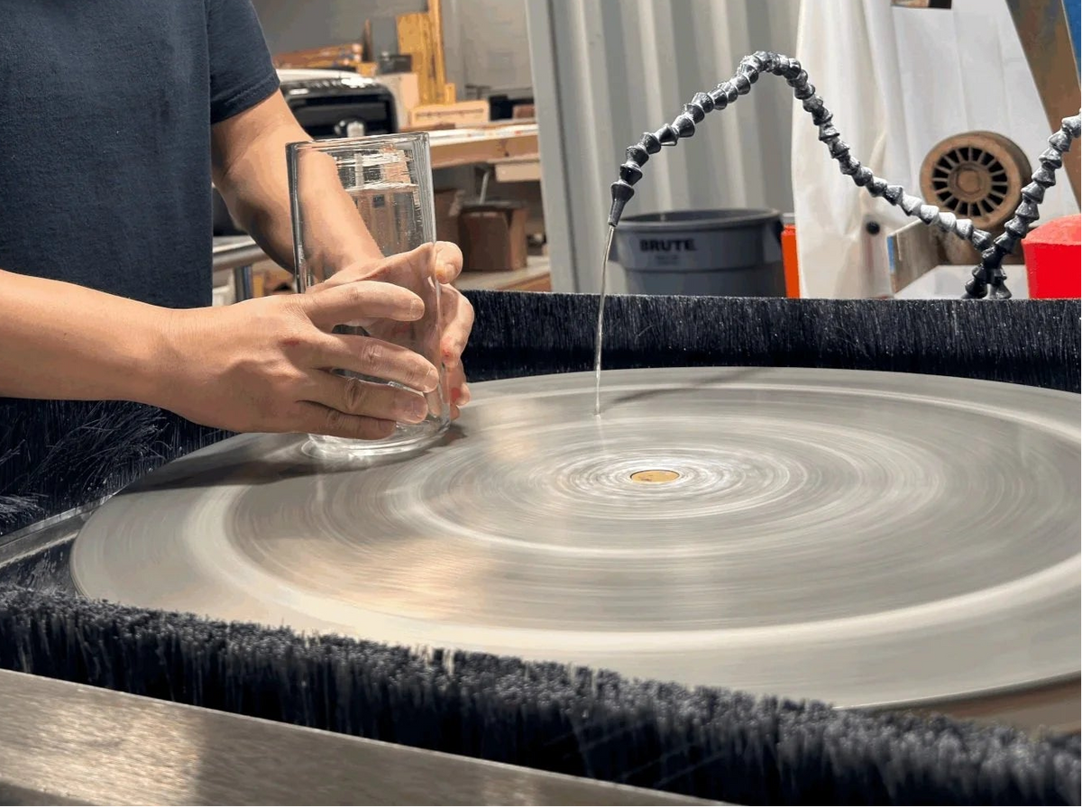 Person working on a lap wheel in a workshop setting