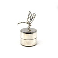 Dragonfly pin on silver container