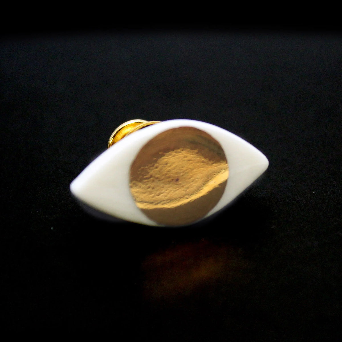 Gold eye pin